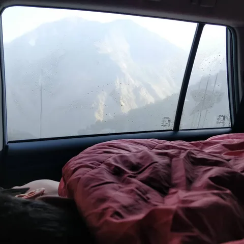 The kids will soon wake up to this view.

The three of us squeezed in at the back tonight. M1 just snuggled in between m