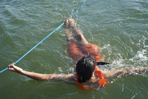 The current was strong enough to require tethering at all times - with two hands, or hands and feet. Otherwise we'd end 
