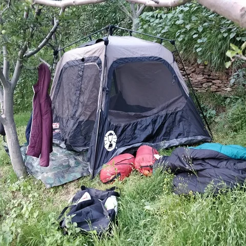 The #tarp is laid out. The instant #tent is popped up. The foam #mattresses have been laid out in the tent. And the slee