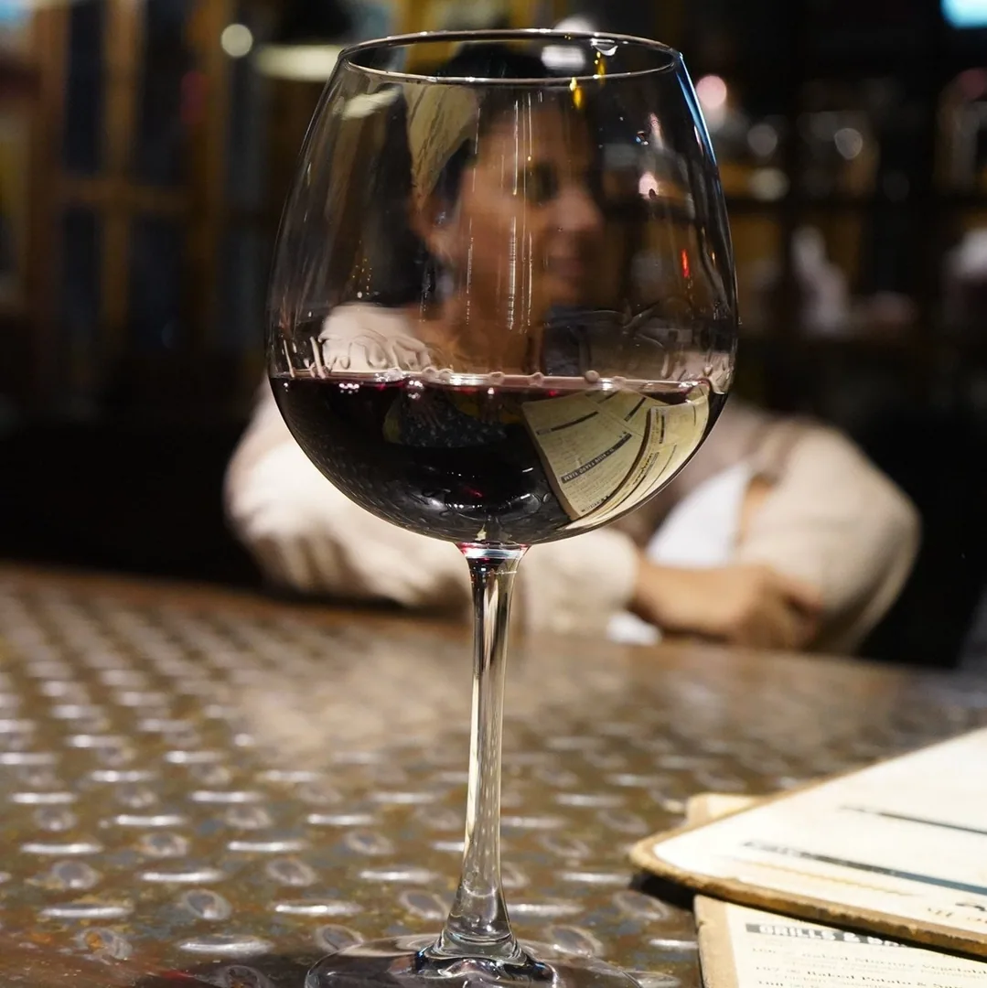 A bottle of wine was ordered and split between five adults. But most people hardly drank their wine. So Aashima was kind