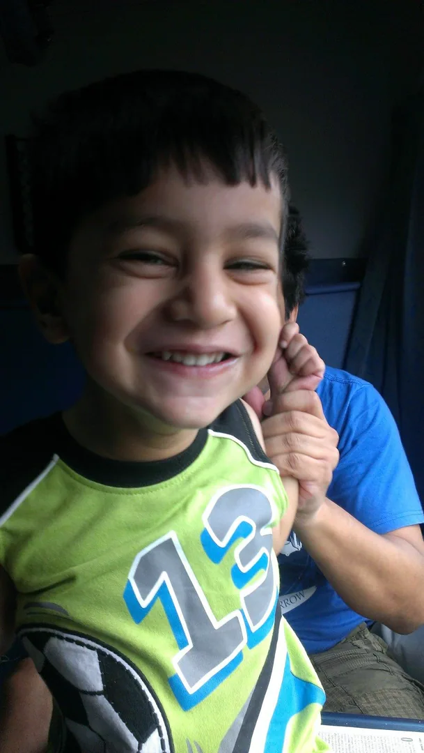 Kavin enjoying a long distance train ride on his fourth birthday