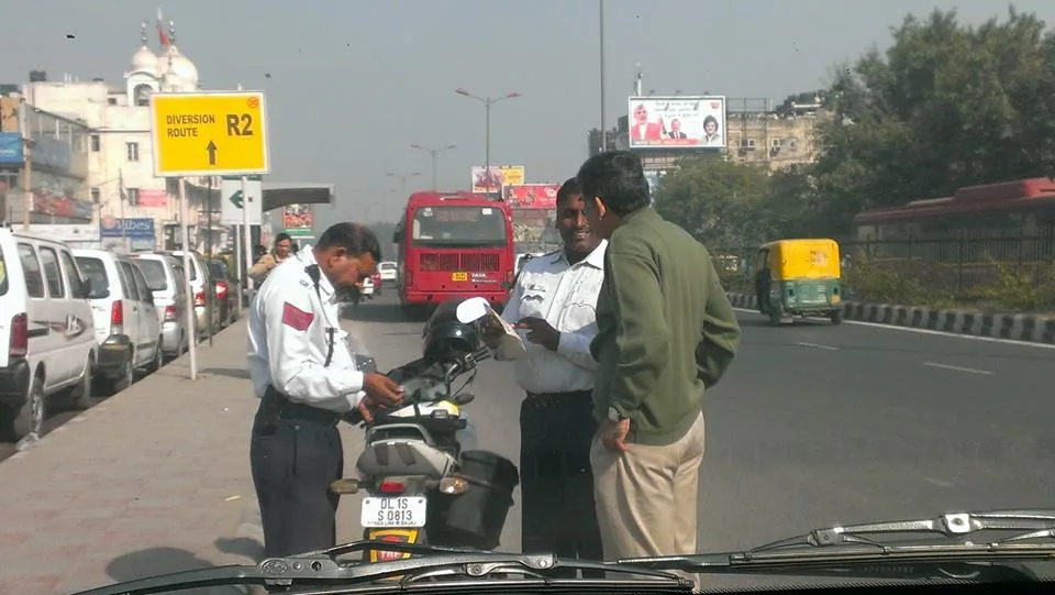 Two honest men, standing in the Sun, doing the right thing. Being a traffic policeman must be the most thankless job in 