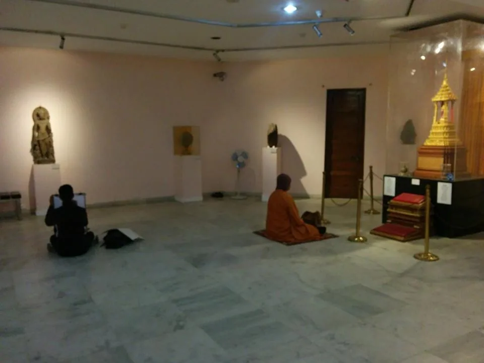 National museum is a regular hangout spot. On the far right, Lord Buddha's actual relics, and dude praying to them. On l