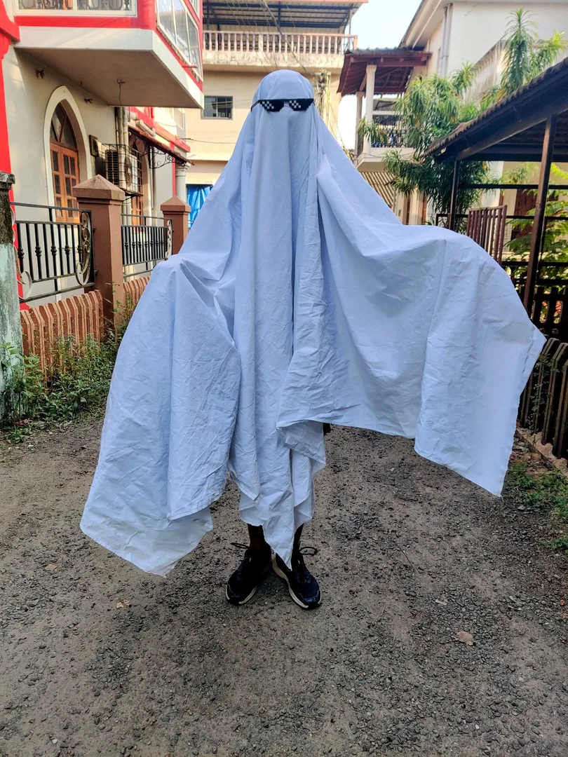 There's a ghost in our street today.

Though he looks more like a Haryanvi farmer in dhoti and shawl going to the fields
