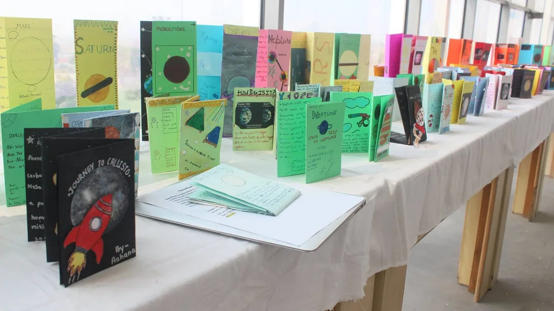 This is what the progeny has been up to in school. Making travel brochures to the moon and the planets. Wanna go for a r