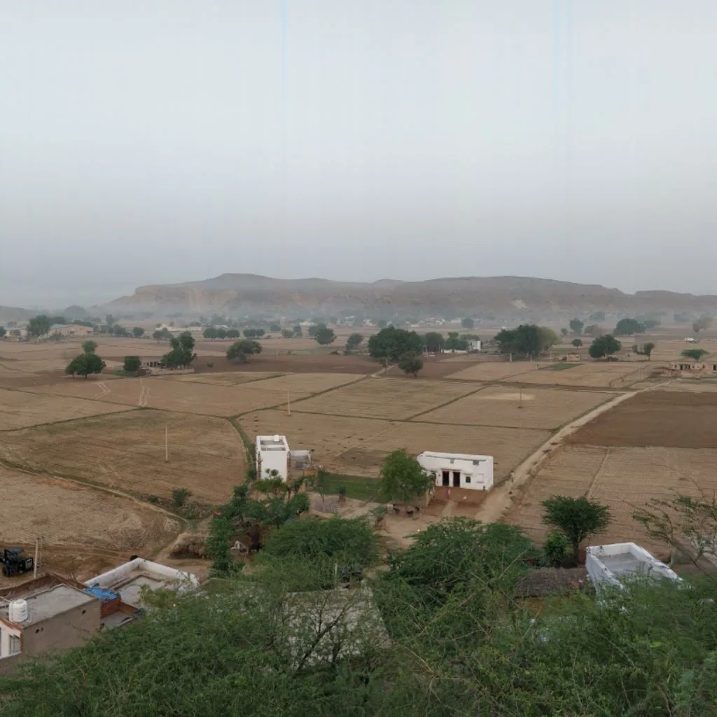 If you look carefully you'll see a fog hanging low over the village right under the hill. Pretty.
