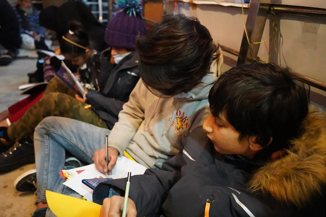 Reading a book. Learning to sketch. Lots of activities for the kids.