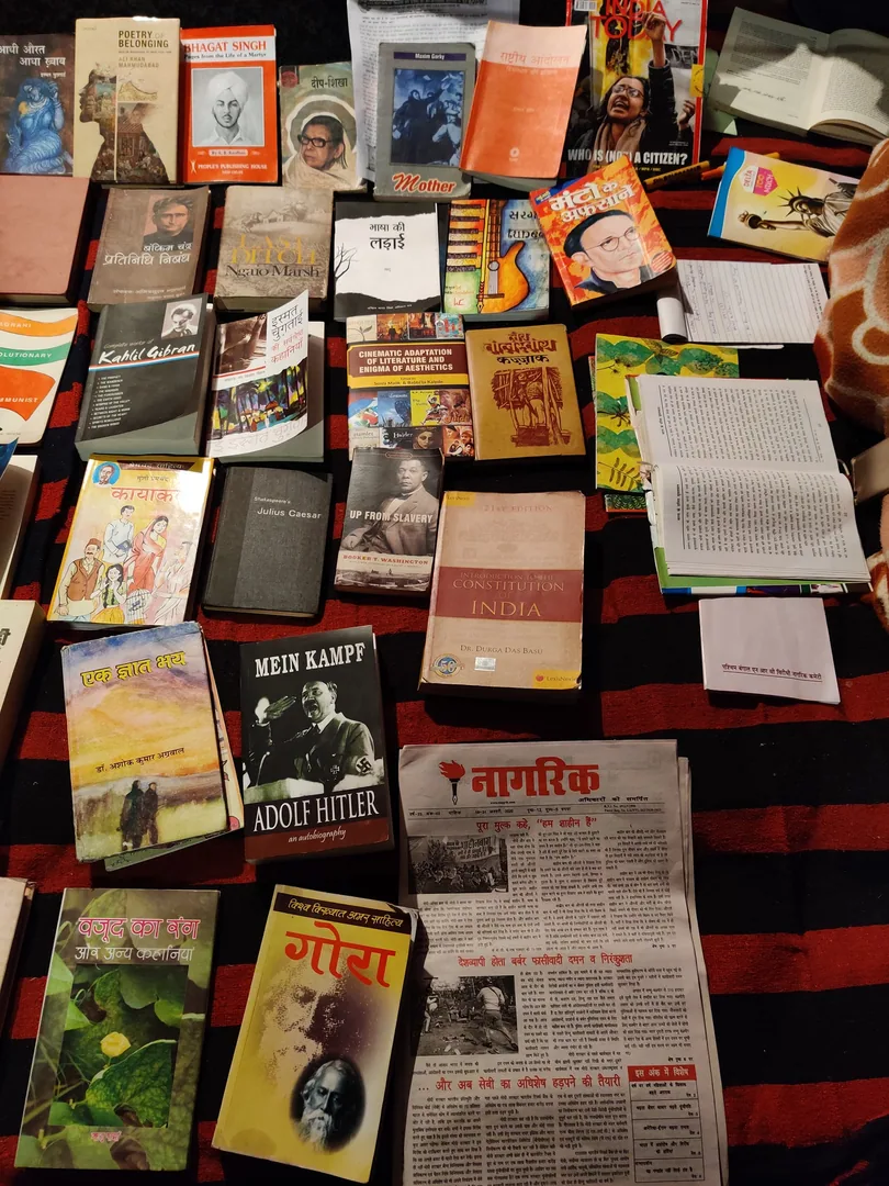 More books. And people sitting and reading amidst the nonstop din and tamasha right in front of their library.