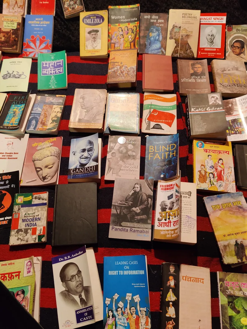 More books. And people sitting and reading amidst the nonstop din and tamasha right in front of their library.